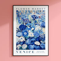 a pink wall with a blue and white flower market poster on it
