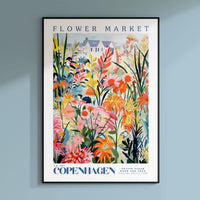 a flower market poster hanging on a wall
