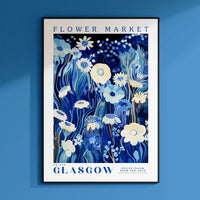 a poster of flowers on a blue wall
