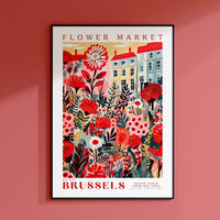 a flower market poster hangs on a pink wall