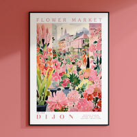 a flower market poster hangs on a pink wall