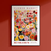 a red wall with a flower market poster on it