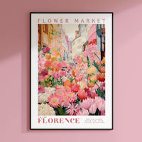 a flower market poster hangs on a pink wall