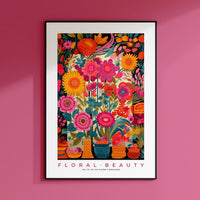 a pink wall with a picture of flowers in vases