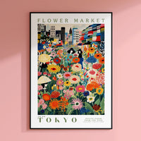a flower market poster hangs on a pink wall