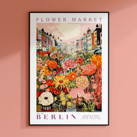 a flower market poster hangs on a pink wall