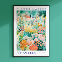 a flower market poster hangs on a green wall