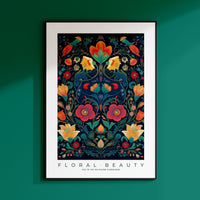 a framed poster of a floral design on a green wall