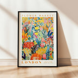 a flower market poster hanging on a wall