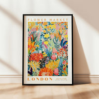 a flower market poster hanging on a wall