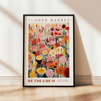 a picture of a flower market poster hanging on a wall