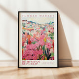 a flower market poster hanging on a wall
