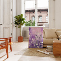 a living room filled with furniture and a painting on the wall