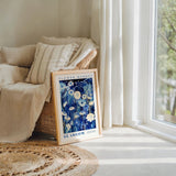 a picture frame sitting on a rug next to a window