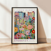 a flower market poster hanging on a wall