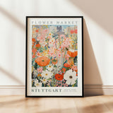 a picture of a flower market poster hanging on a wall