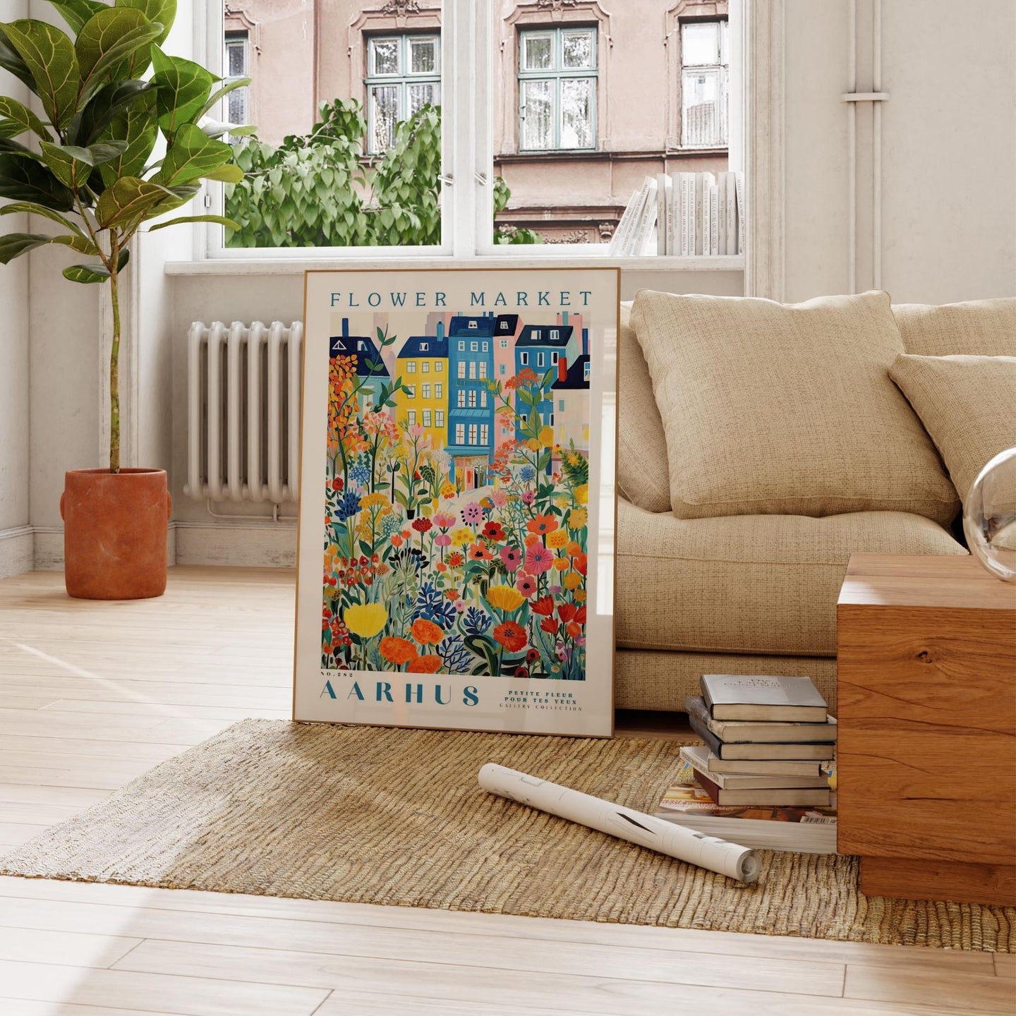a living room with a couch and a poster on the floor