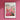 a pink flower market poster hangs on a pink wall