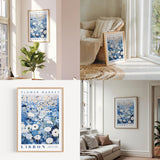 a living room filled with furniture and a flower market poster