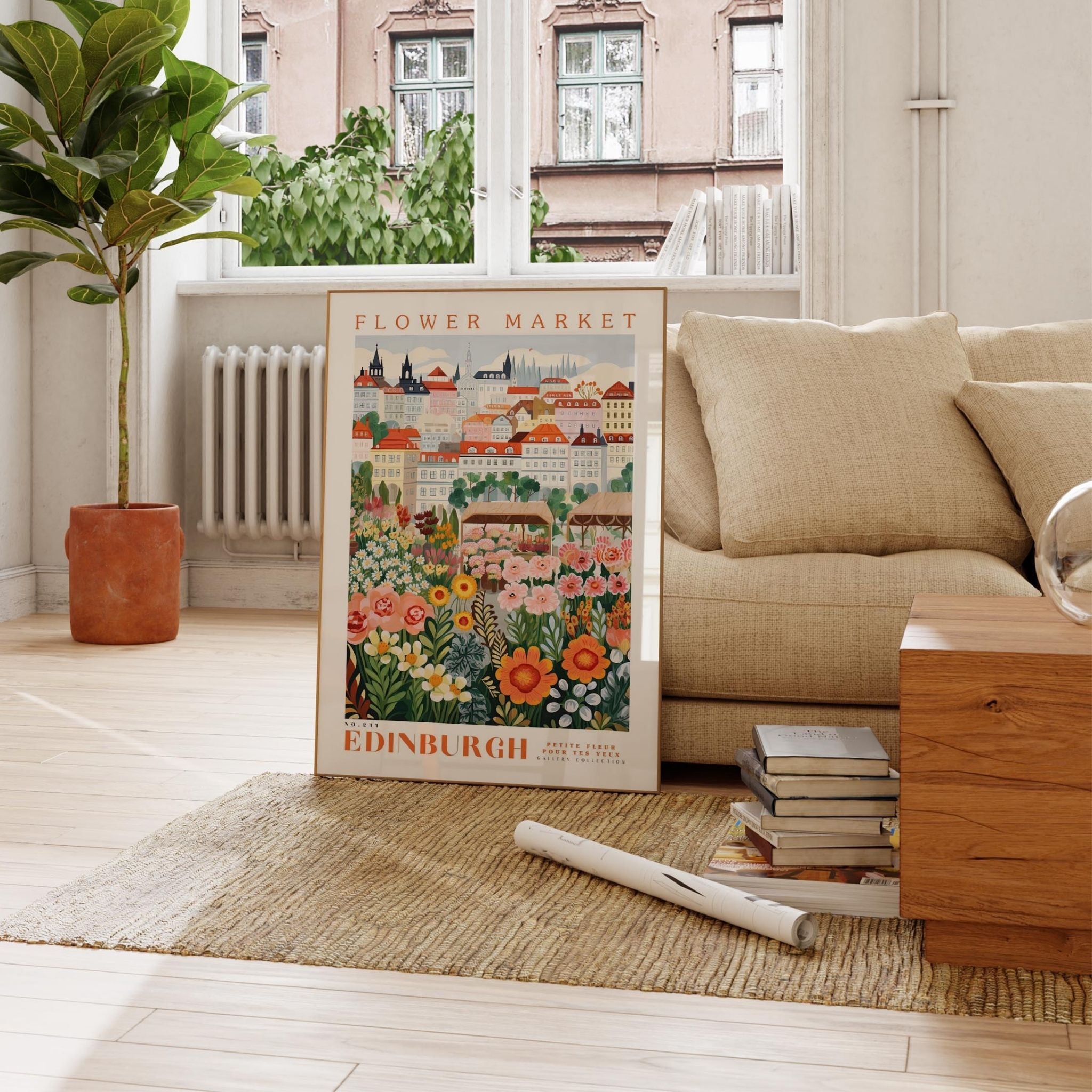a living room with a couch and a poster on the floor