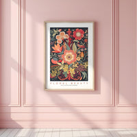 a pink room with a pink wall and a framed floral print