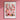 a pink flower market poster hanging on a pink wall