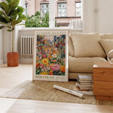 a living room with a couch and a painting on the floor