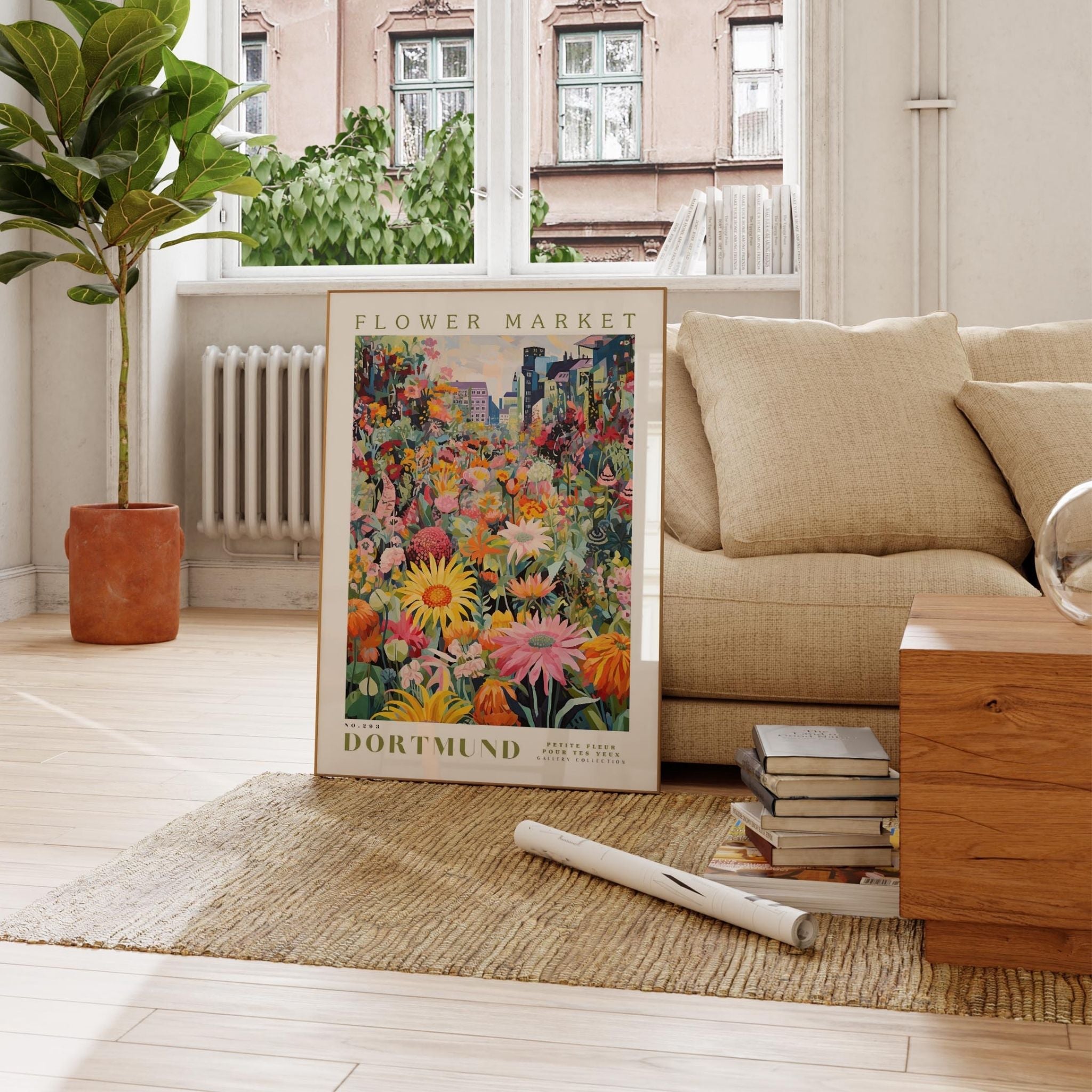 a living room with a couch and a painting on the floor