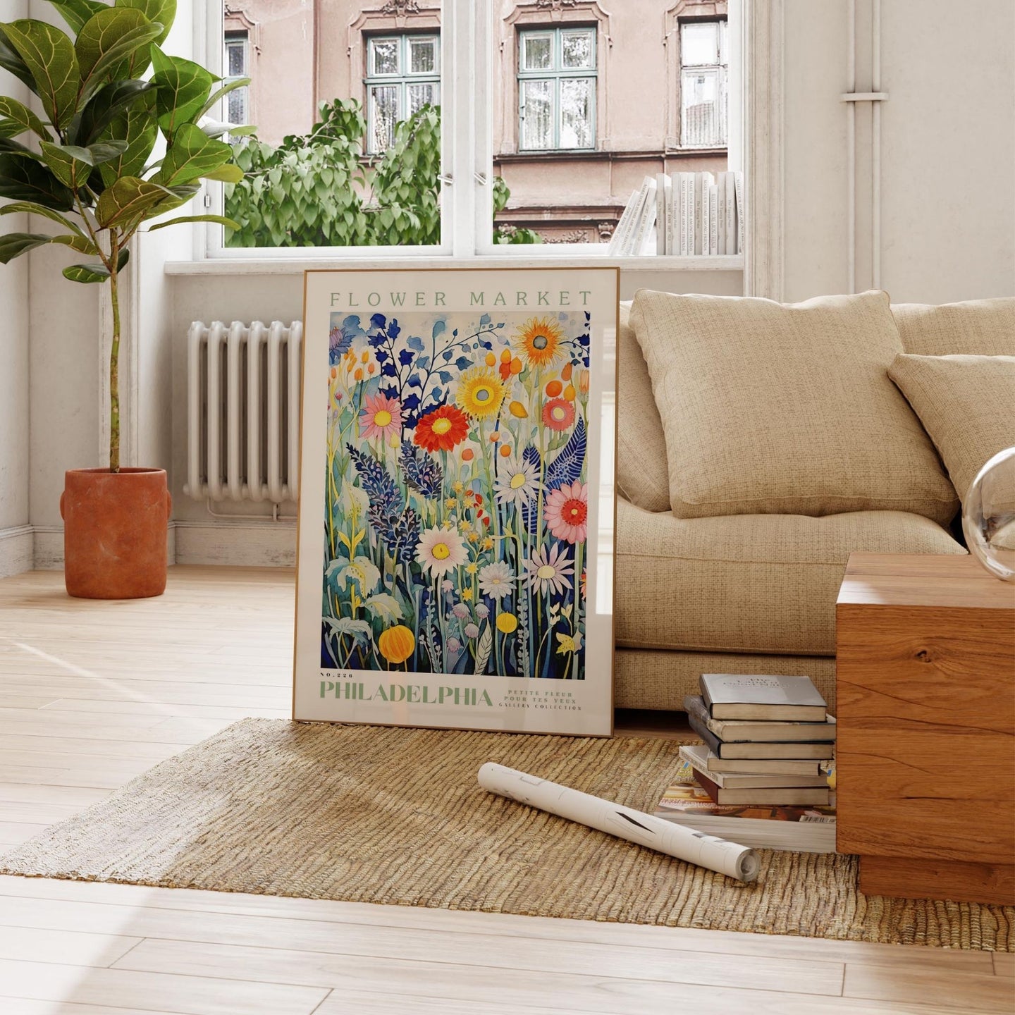 a living room with a couch and a painting on the floor