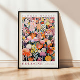 a flower market poster hanging on a wall