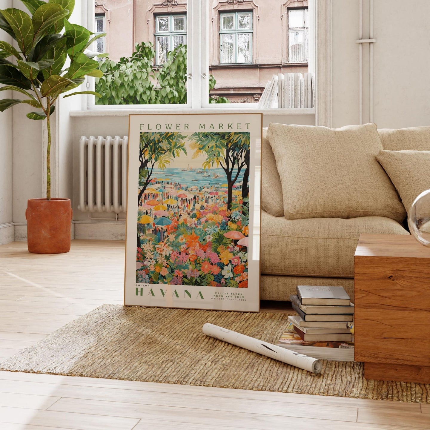 a living room with a couch and a painting on the floor