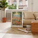 a living room with a couch and a painting on the floor