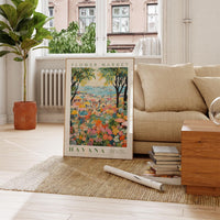 a living room with a couch and a painting on the floor