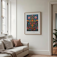 a living room with a couch and a painting on the wall