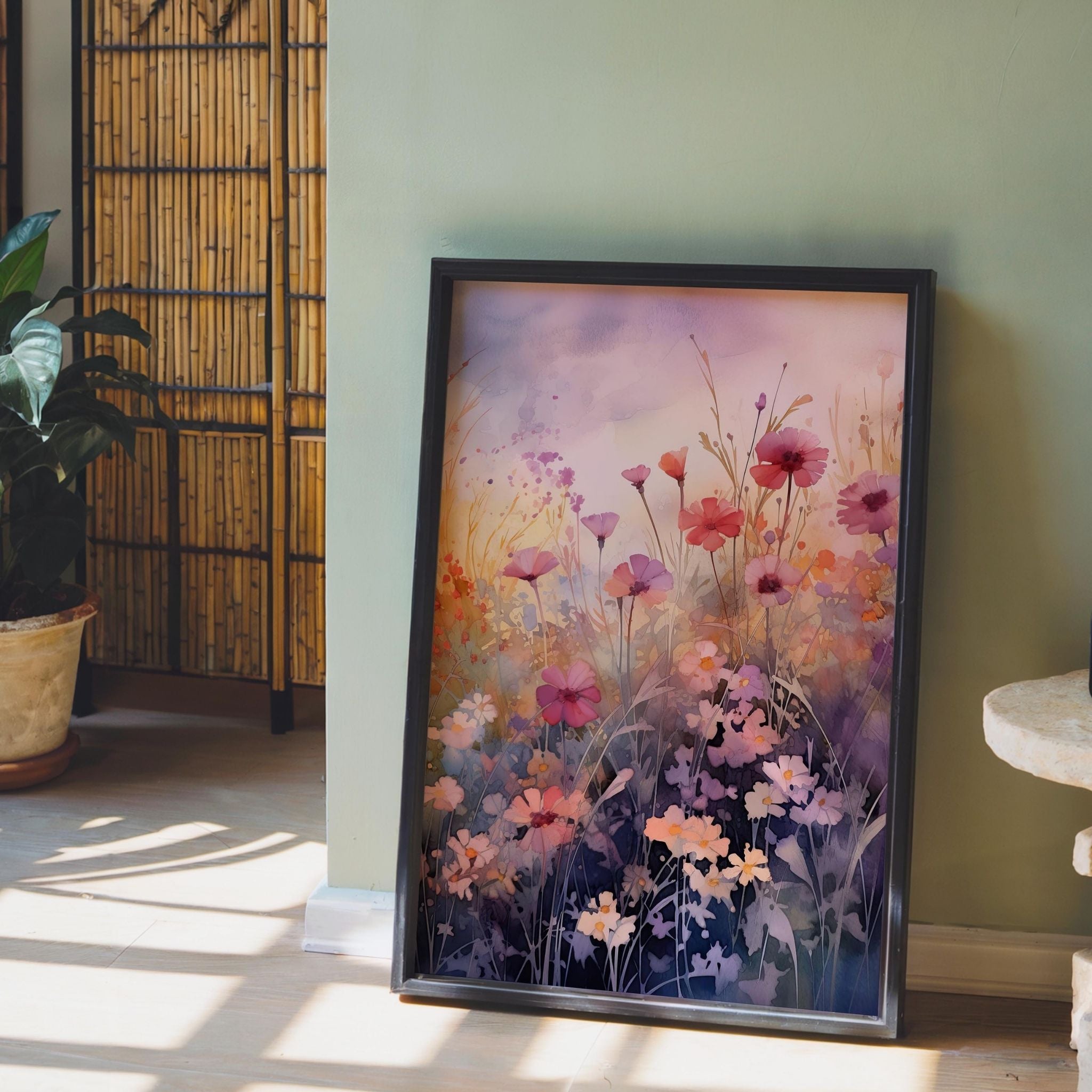 a painting of flowers in a frame on a table
