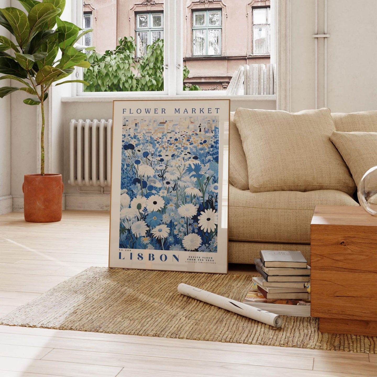 a living room with a couch and a poster on the floor