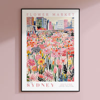 a poster hanging on the wall of a pink room