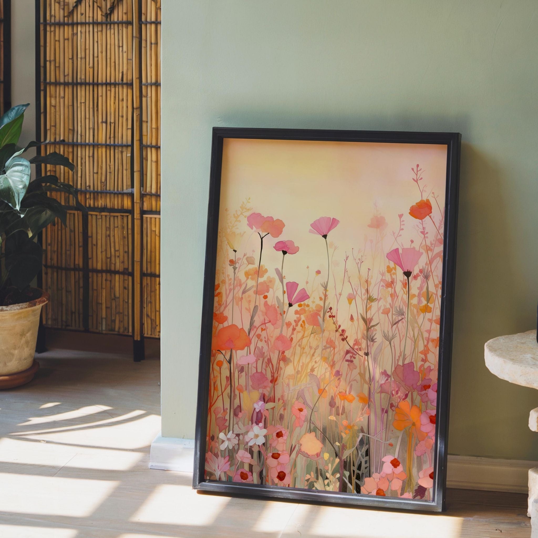 a picture of a painting on a wall next to a potted plant