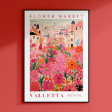 a red wall with a poster of a flower market
