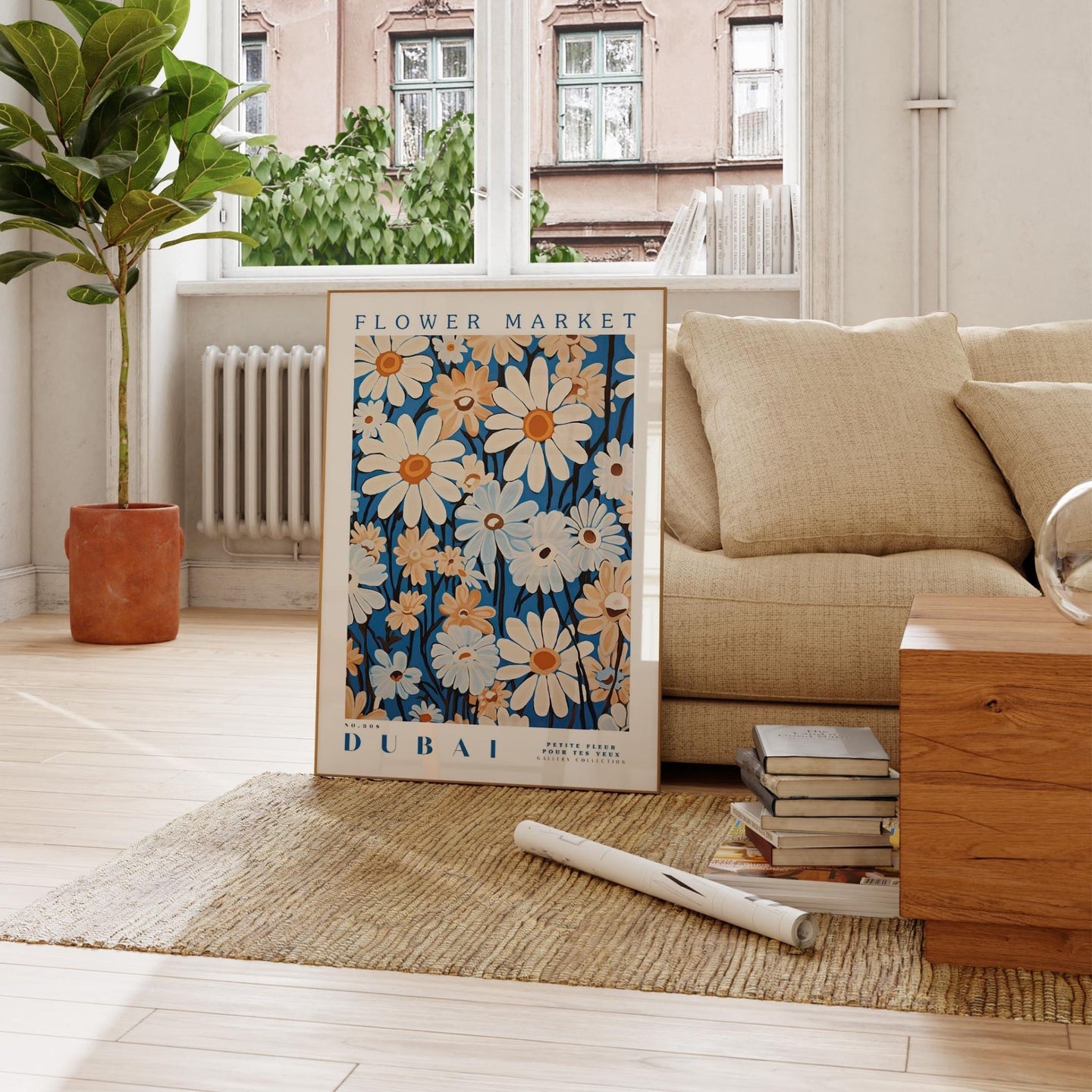 a living room with a couch, coffee table and a poster on the floor