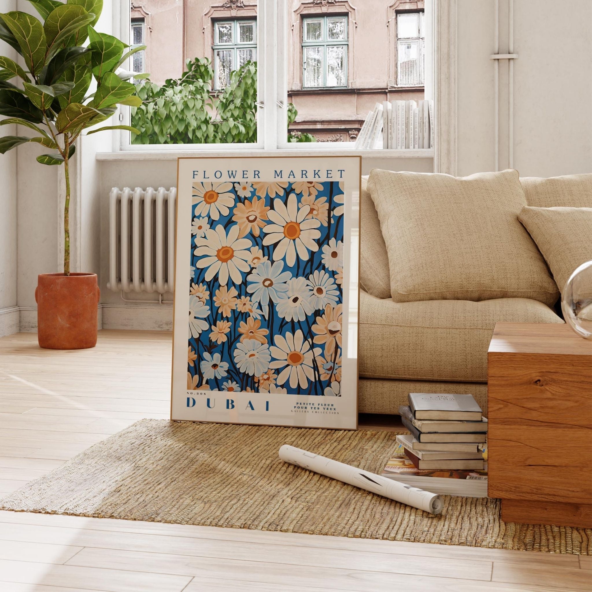 a living room with a couch, coffee table and a poster on the floor