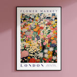 a flower market poster hangs on a pink wall