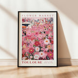 a flower market poster hanging on a wall
