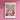 a pink wall with a flower market poster on it