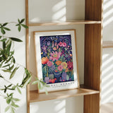 a picture of a vase of flowers on a shelf