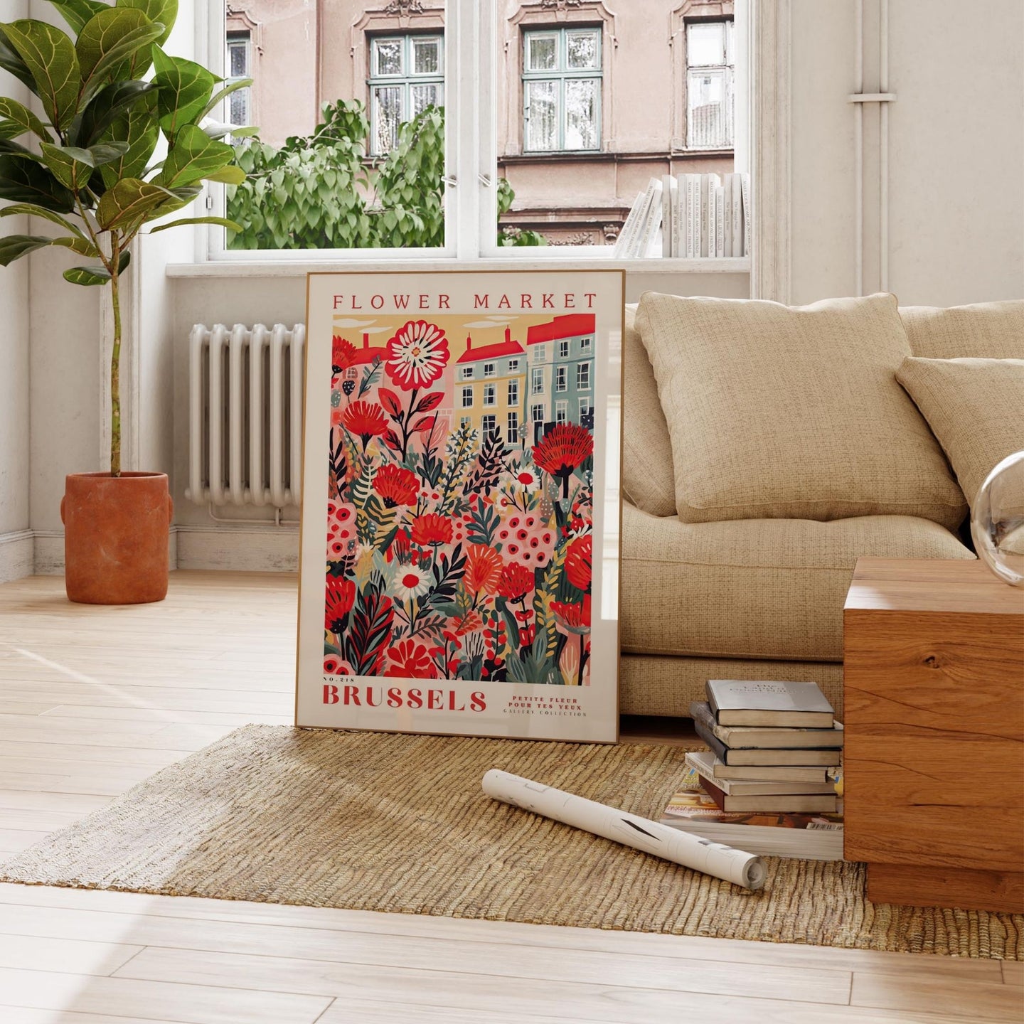 a living room with a couch and a poster on the floor