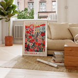 a living room with a couch and a poster on the floor
