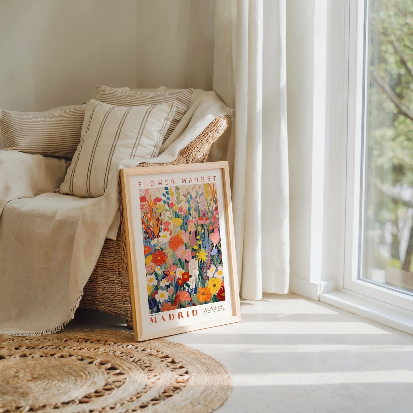 a picture frame sitting on top of a rug next to a window