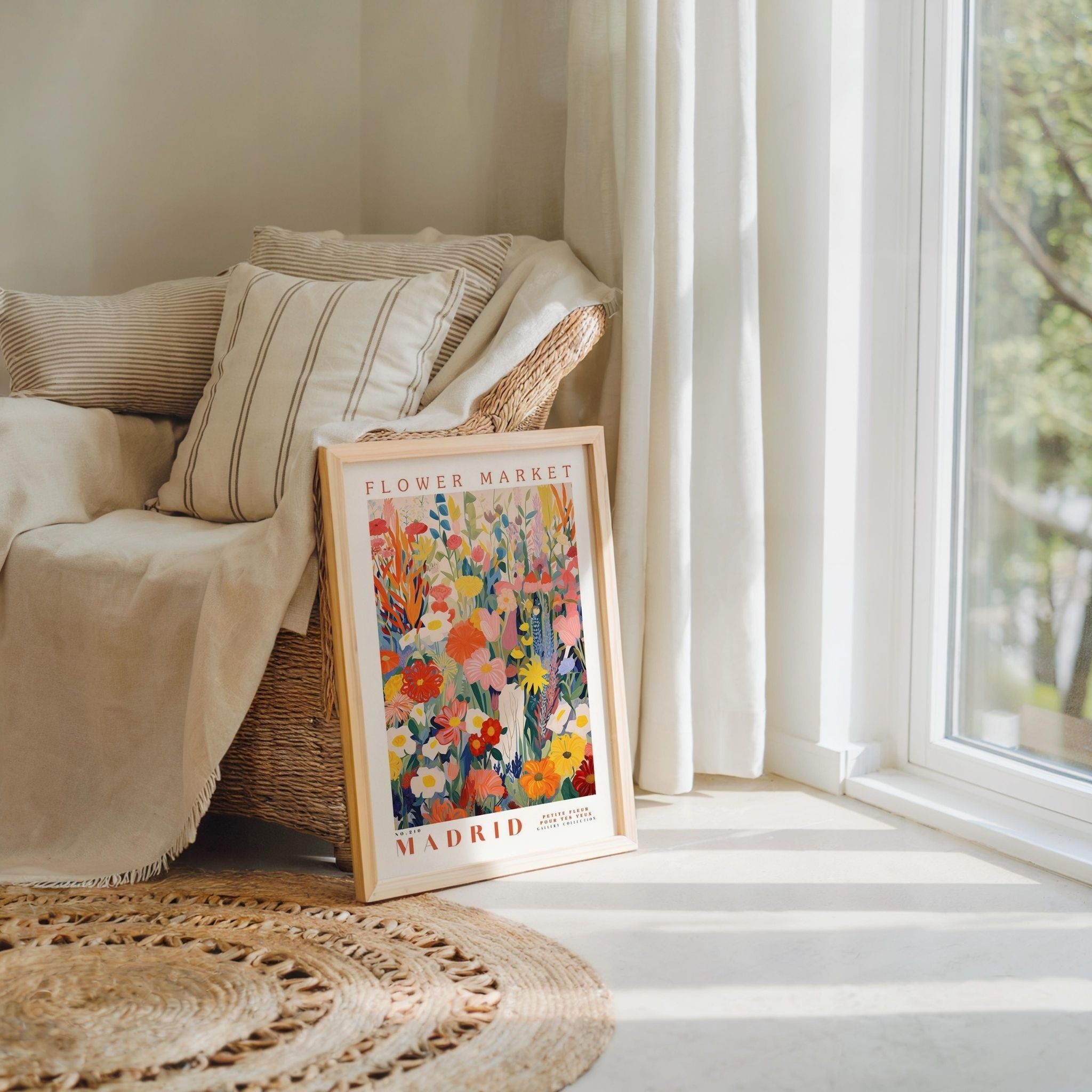 a picture frame sitting on top of a rug next to a window