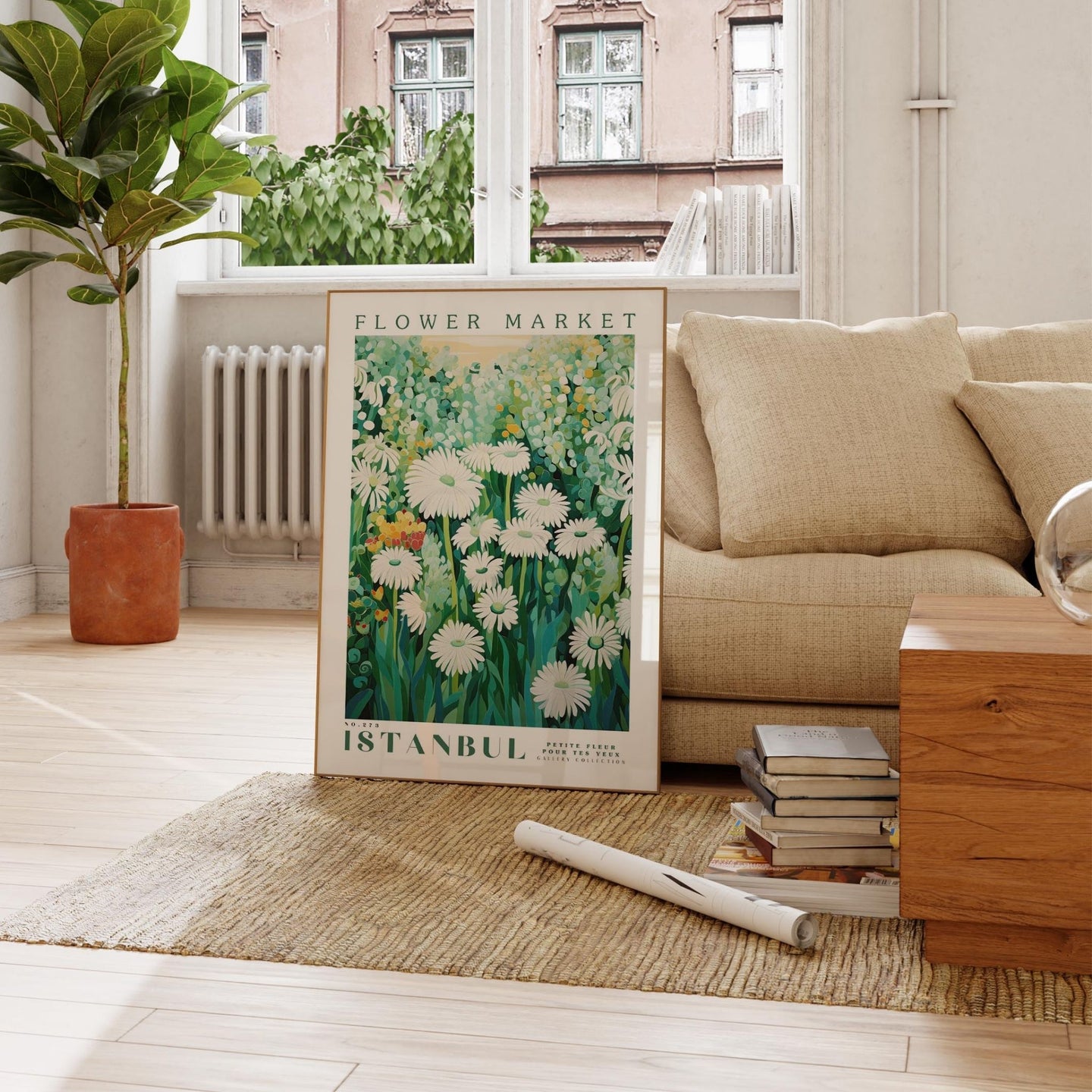 a living room with a couch and a painting on the floor